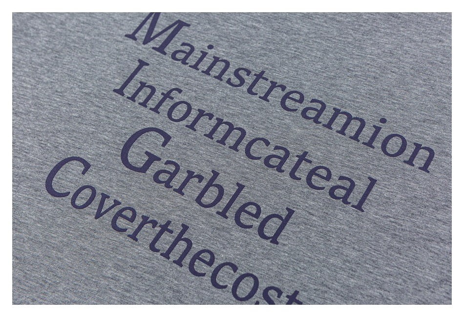 Close-up of dark purple English lettering printed on heather-gray shirt fabric.