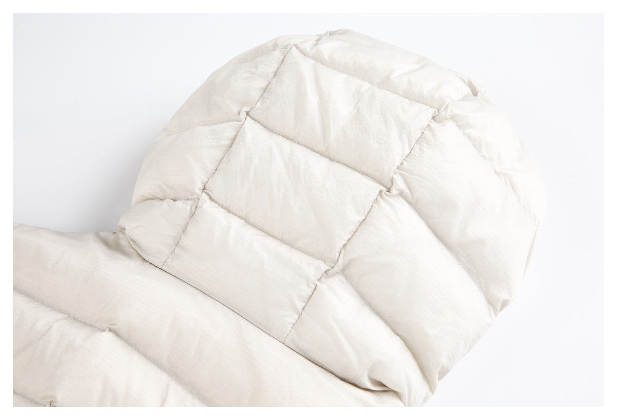 Close-up of the ivory padded jacket hood with broad quilted sections.