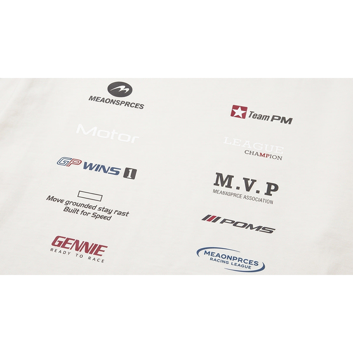 Close-up of racing-inspired words and assorted logos printed on white shirt fabric.