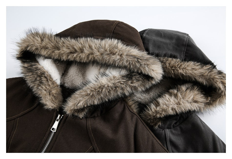 Close-up of brown and black jacket hoods showing brown fur trim and soft white lining.