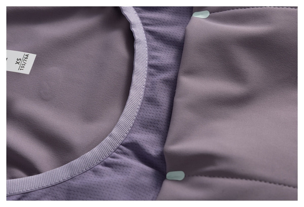 Inside view of the mauve top with mesh lining, pale fasteners, and an XS size label.