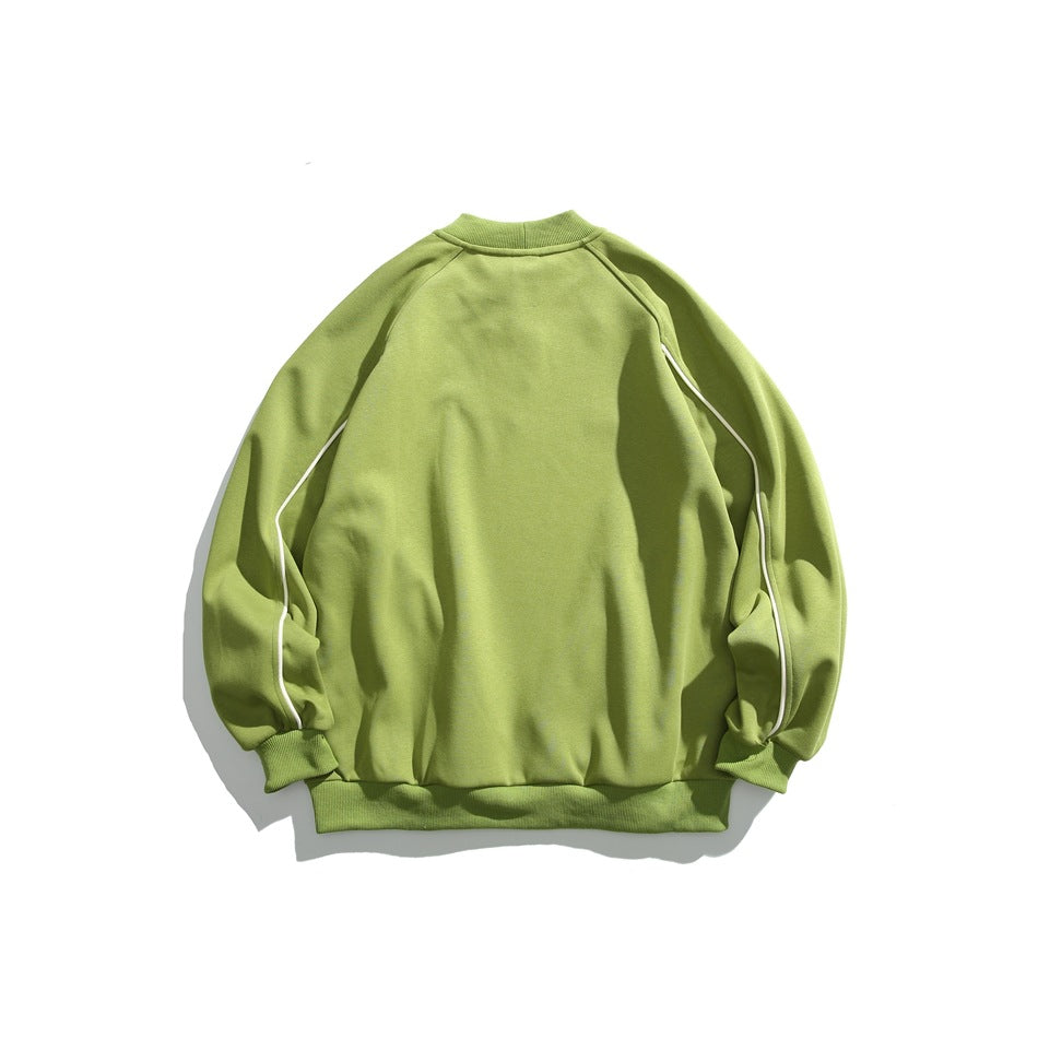Back of a light green crewneck sweatshirt with white piping along the raglan sleeves.