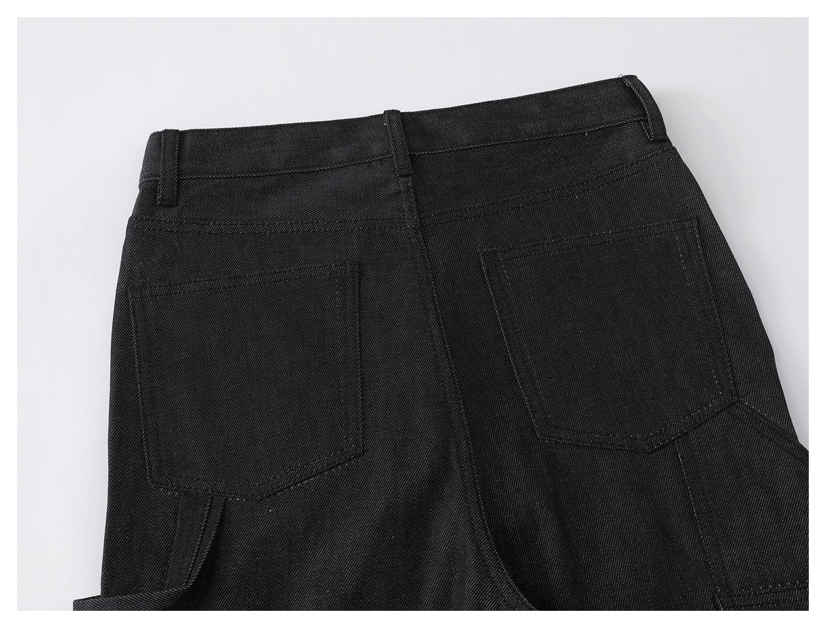 Close-up of the back of black pants, showing the waistband, belt loops, and two rear pockets.