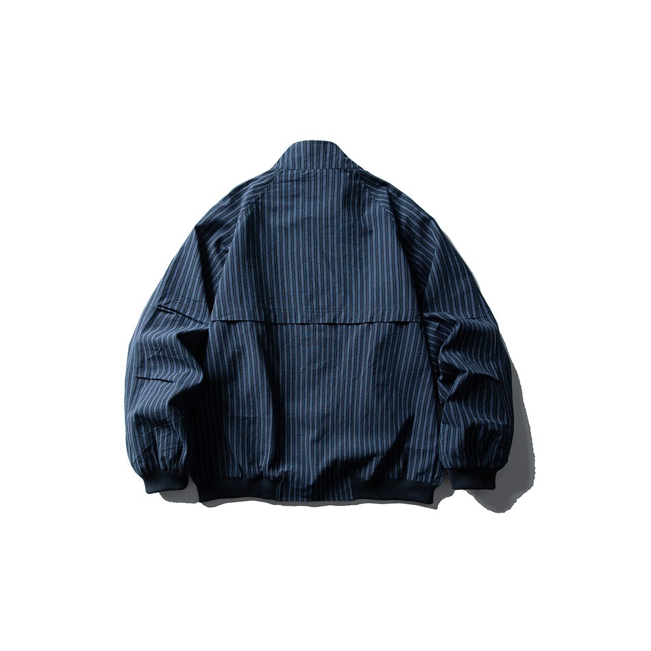 Back view of dark blue striped jacket with back yoke seam, stand collar and ribbed cuffs and hem