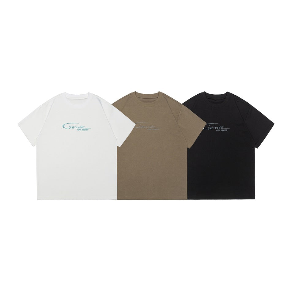 Front views of short-sleeve crew-neck T-shirts in white, brown, and black with small rhinestone-style chest designs.