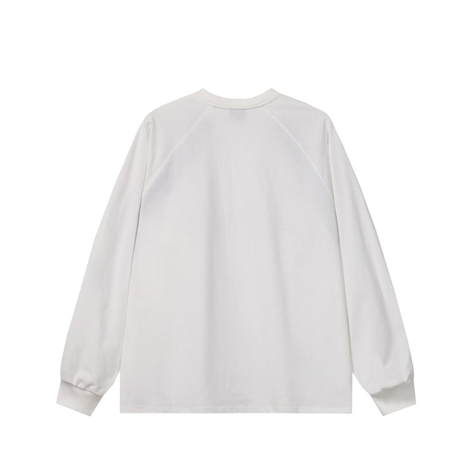 Back view of a plain white long-sleeve crewneck top with raglan seams and ribbed cuffs.
