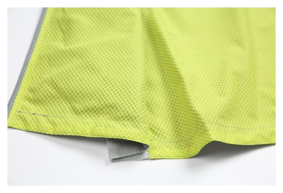 Close-up of the jacket's bright neon yellow mesh lining with gray seam details.