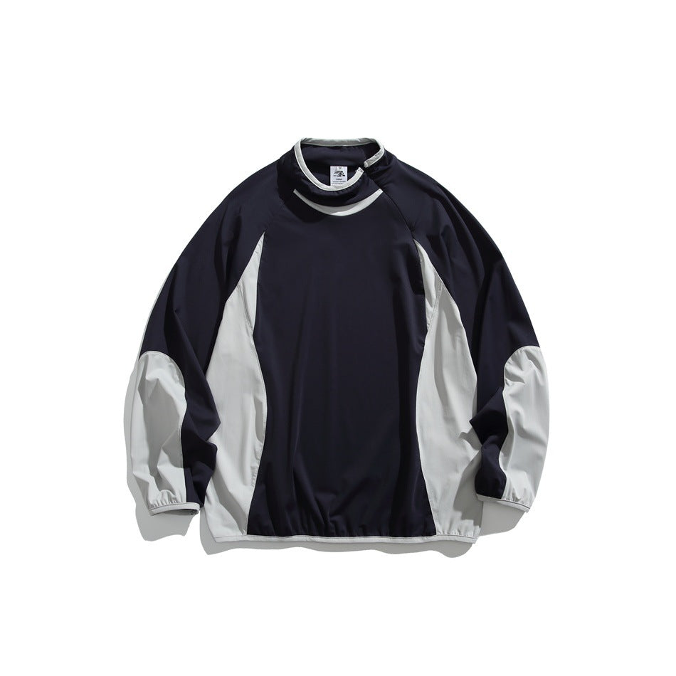 Navy pullover with light gray side panels and lower sleeves, funnel neck with piping, flat lay front view