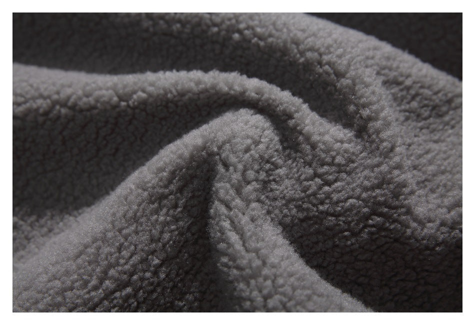 Close-up showing the plush gray pile texture of a jacket.