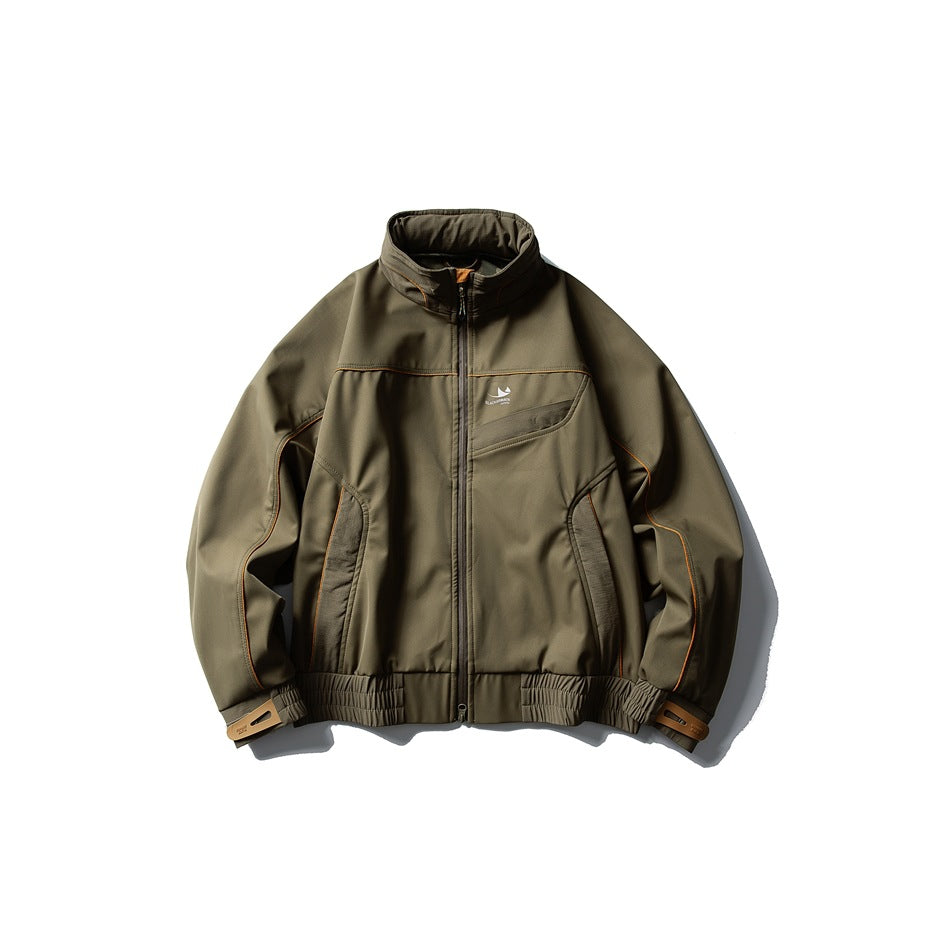 Olive green stand-collar zip jacket with orange piping, panel details and tan cuff tabs, flat lay front