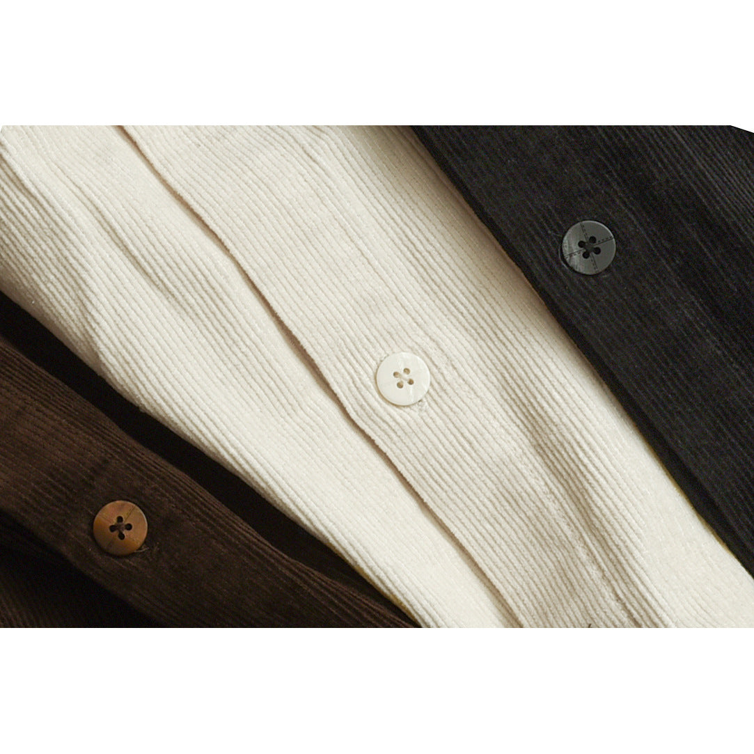 Close-up of cream, dark brown, and charcoal ribbed shirt fabric with matching buttons.
