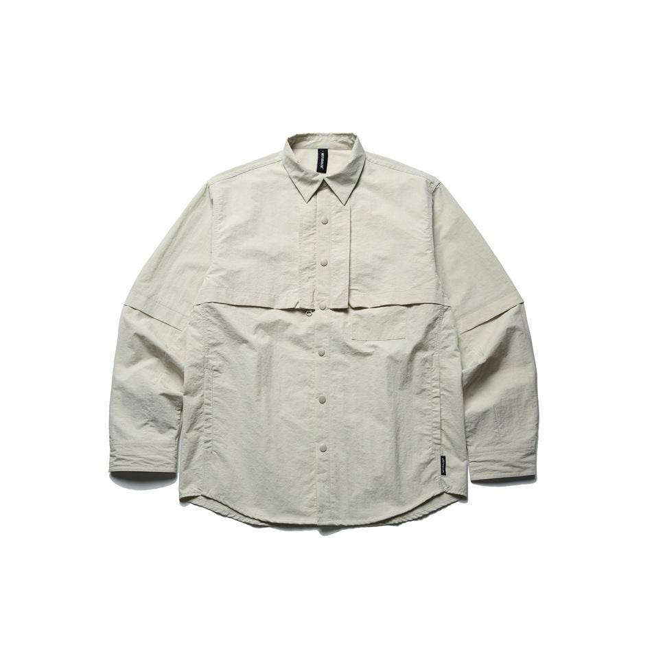 Off-white long-sleeve snap-front shirt jacket with layered chest panel and chest pocket, flat lay on white