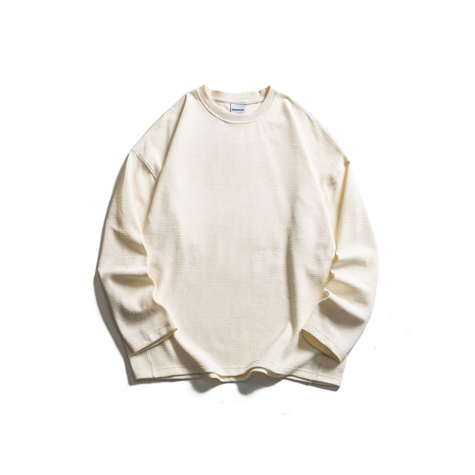 Cream long-sleeve crew-neck sweatshirt flat lay with waffle-style textured block pattern