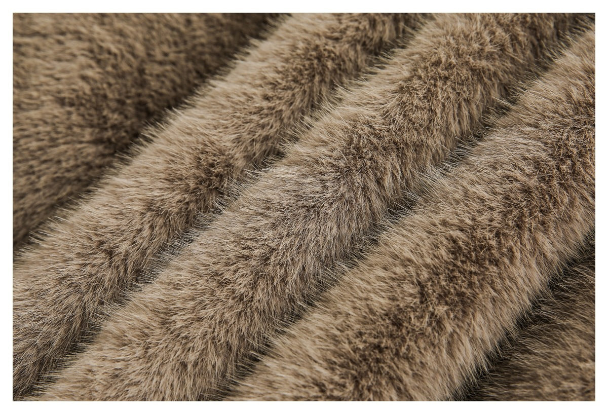 Macro view of the dense, mottled brown faux-fur surface.