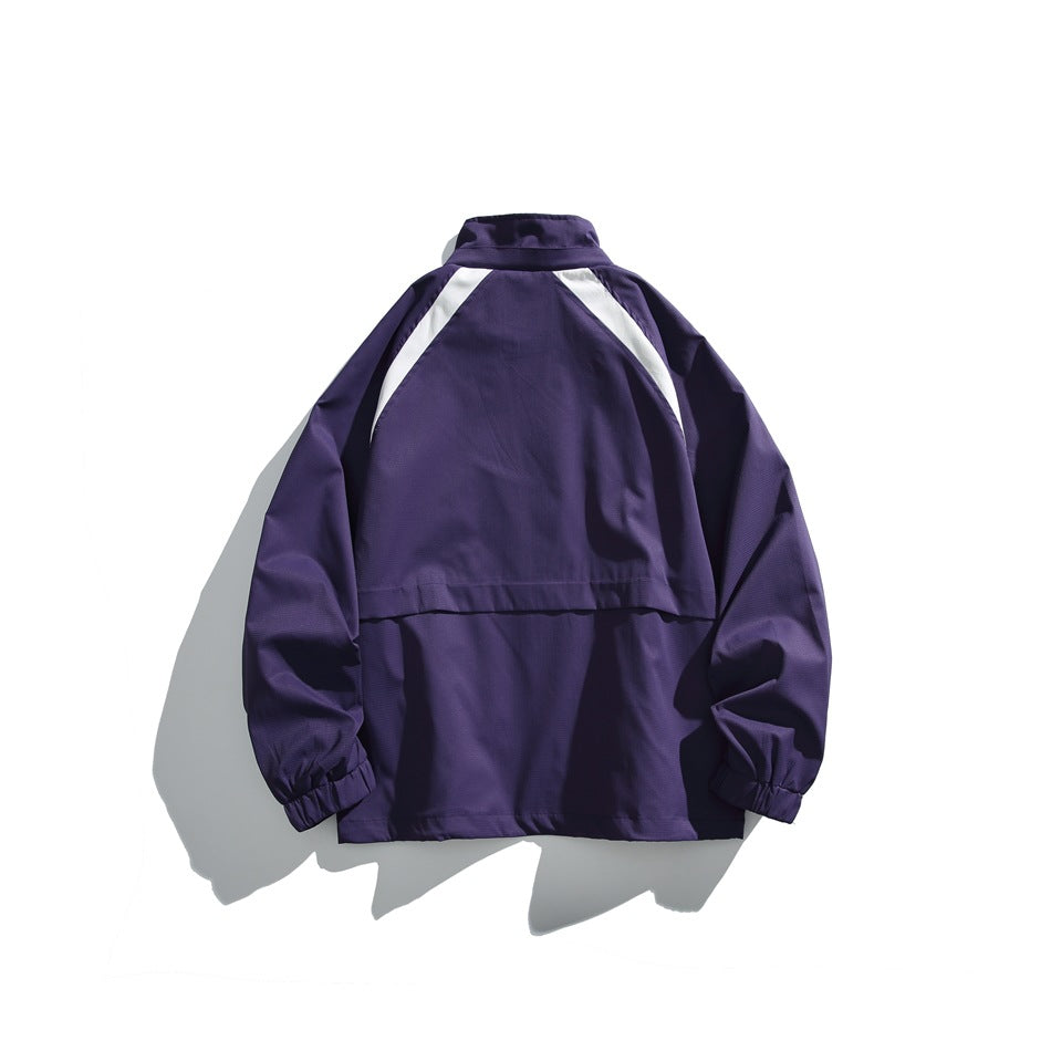 Back view of a purple jacket with a high collar, white shoulder accents, and elastic cuffs, laid flat.