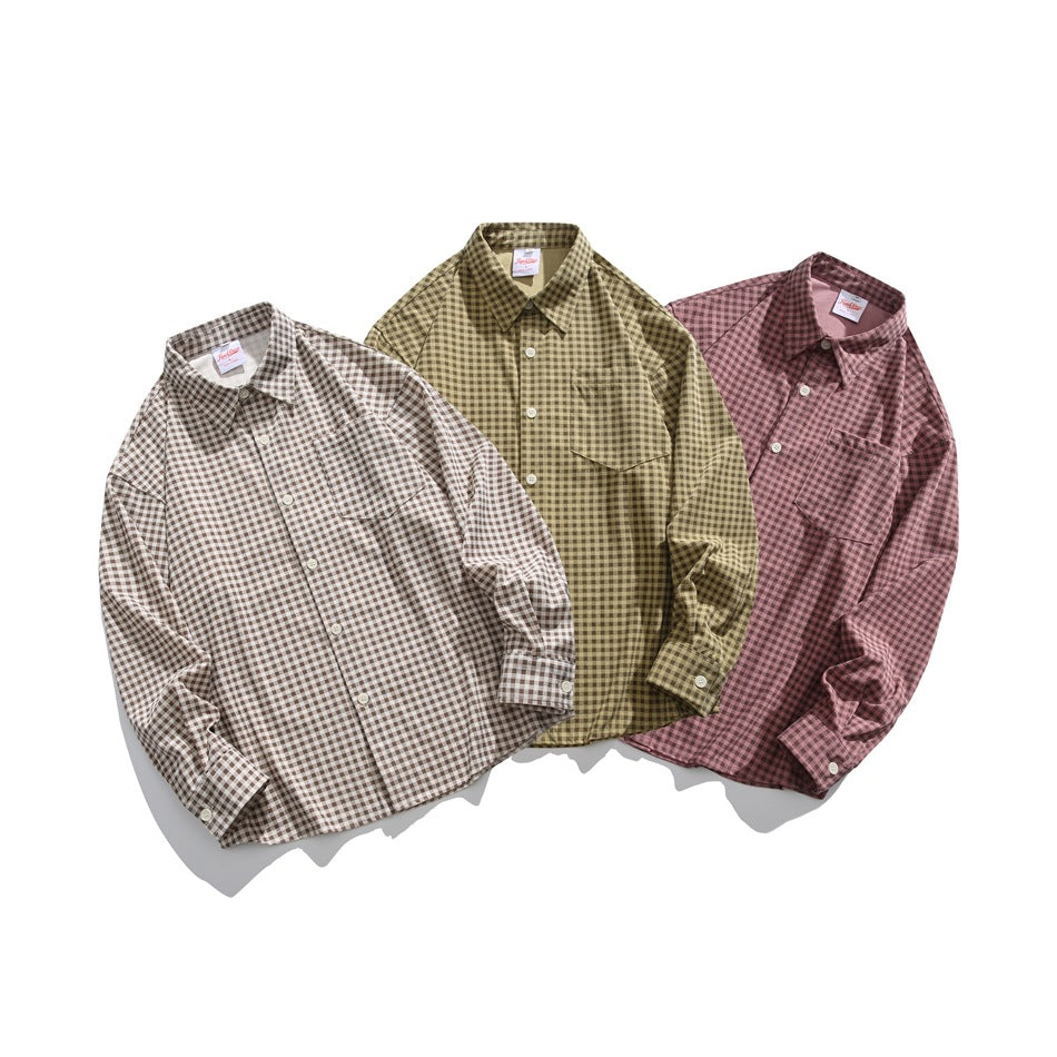 Three check shirts displayed together in taupe, olive, and dusty pink; each has a collar and button front.