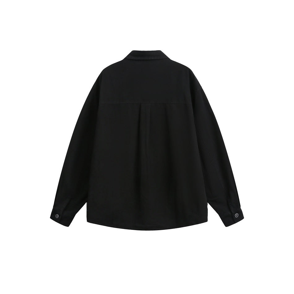 Back view of a black long-sleeve button-up shirt with a pointed collar, shoulder yoke, and buttoned cuffs.