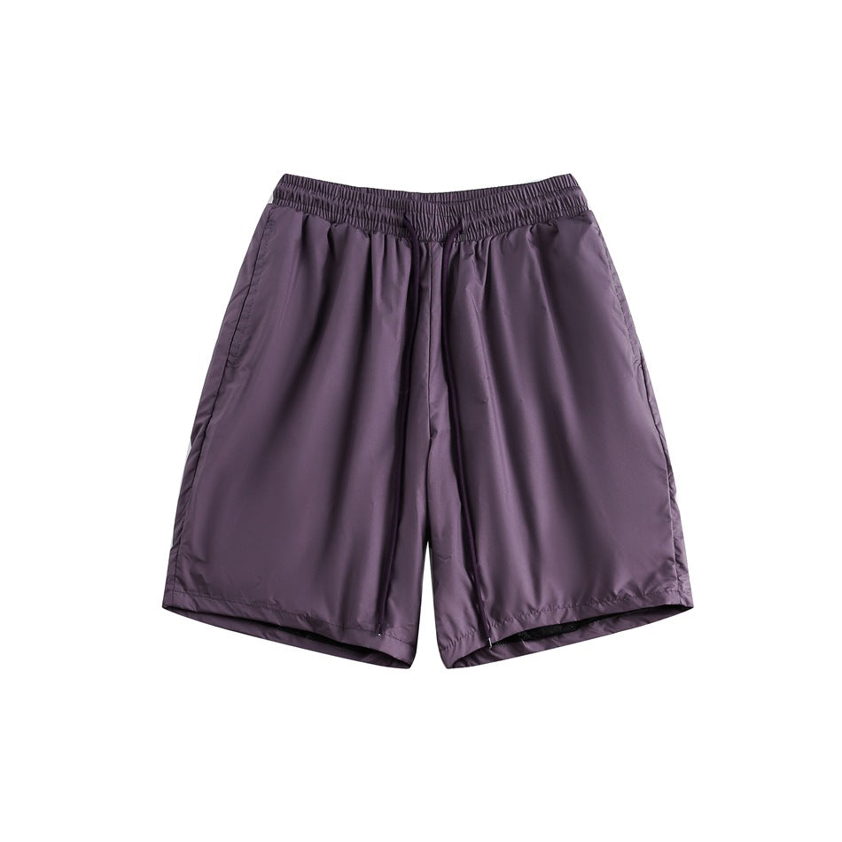 Purple knee-length shorts with an elastic drawstring waistband, flat lay front view on white background