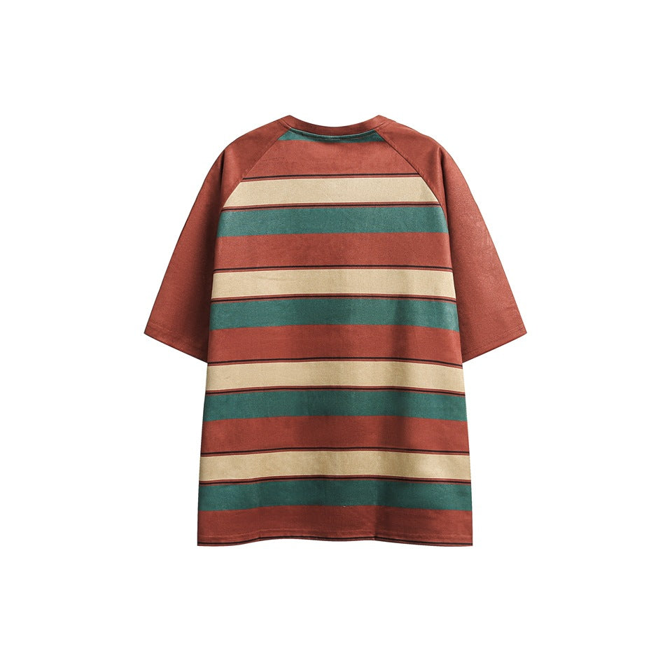 Back view of a rust-red T-shirt with broad teal and cream horizontal stripes and short raglan sleeves.