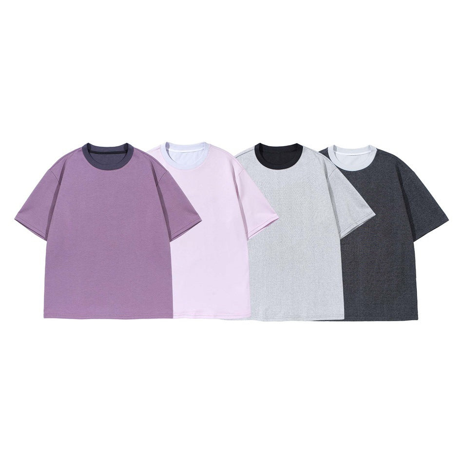 Four short-sleeve crew-neck T-shirts shown together in purple, pale pink, light gray, and charcoal.