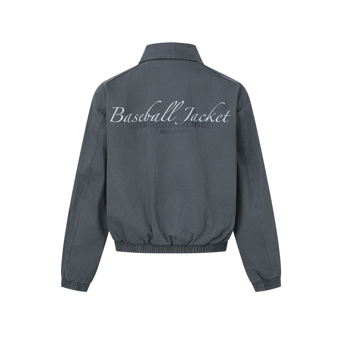 Back view of a charcoal jacket with elastic cuffs and hem and large script reading “Baseball Jacket.”