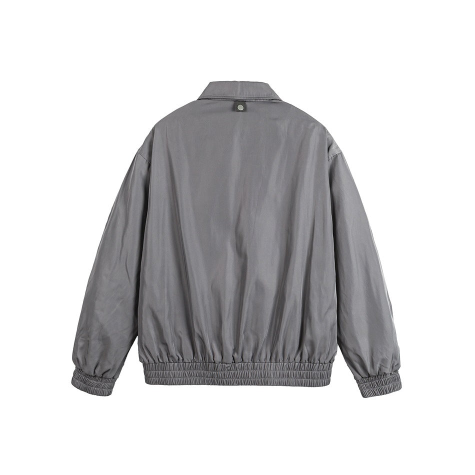 Back view of a plain gray jacket with a collar, long sleeves, gathered cuffs and elastic hem.