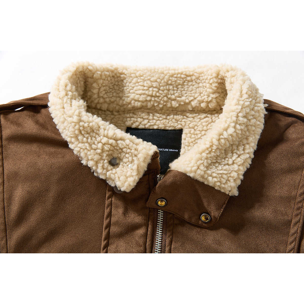Close-up of a brown jacket’s cream fleece collar, snap-tab closure and upper zipper.