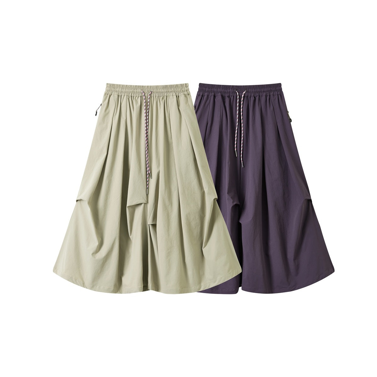 Two pairs of draped wide-leg pants shown from the front in pale sage and deep muted purple, with elastic waists and