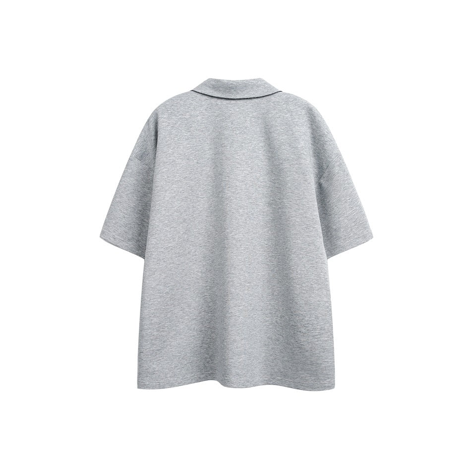 Back view of a light gray oversized short-sleeve polo with a simple collar.