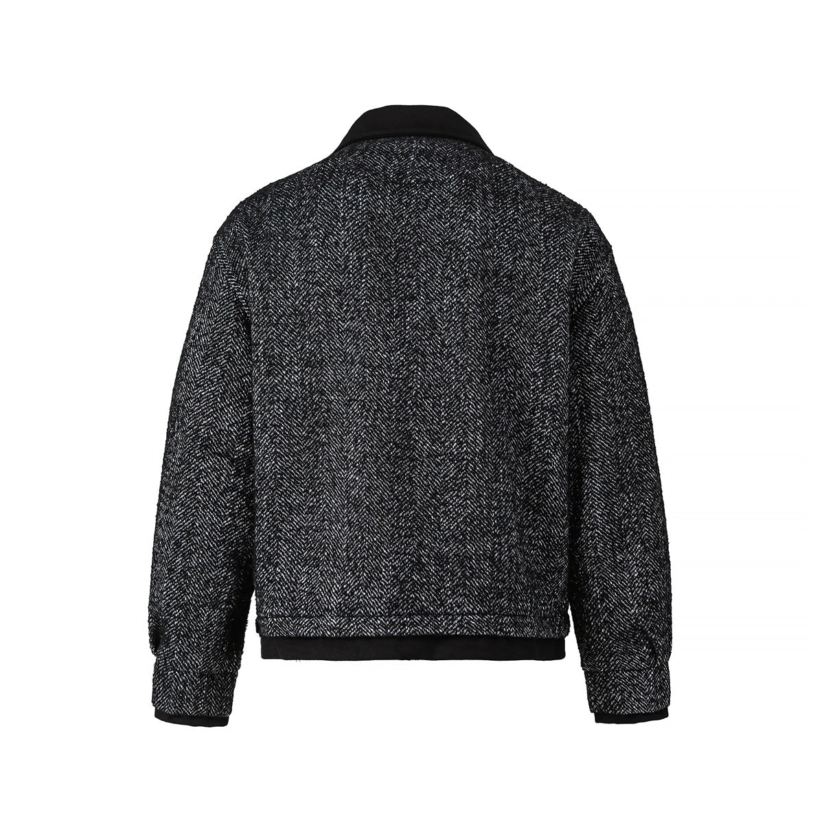 Back view of a black-and-white herringbone jacket with a black collar, cuffs, and hem trim.