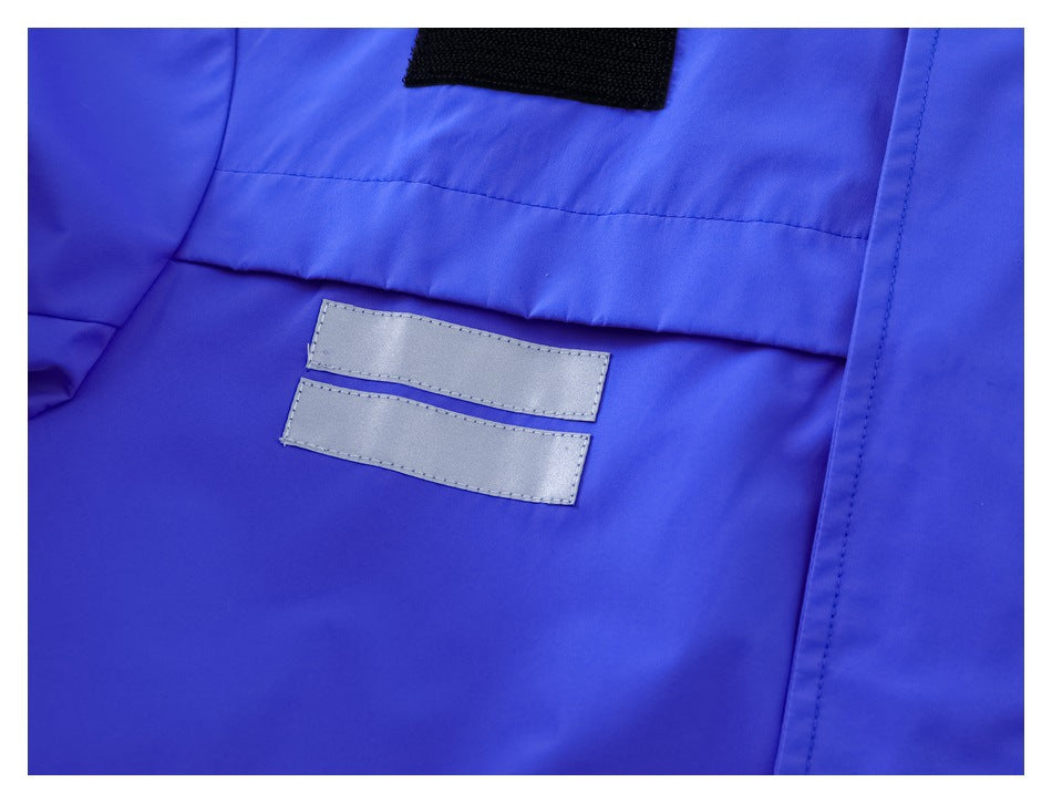 Close-up of two horizontal silver reflective strips on the blue jacket.
