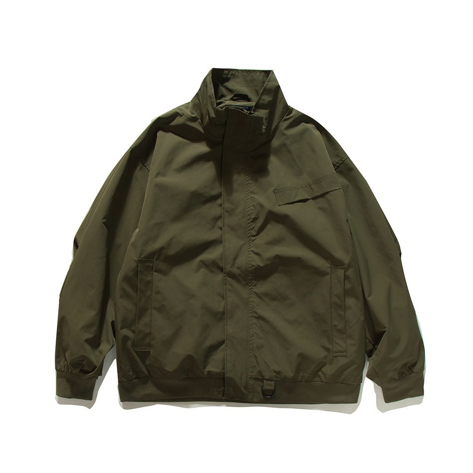 Army green stand-collar jacket flat lay, front view with chest flap pocket, slip pockets and ribbed hem