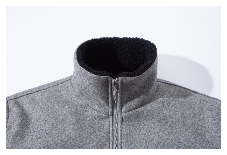 Close-up of the gray jacket's zipped stand collar, with black plush lining visible inside.