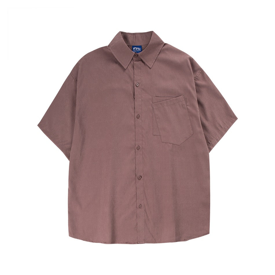 Dusty pink short-sleeve button-up shirt with collar and chest pocket, flat lay front view