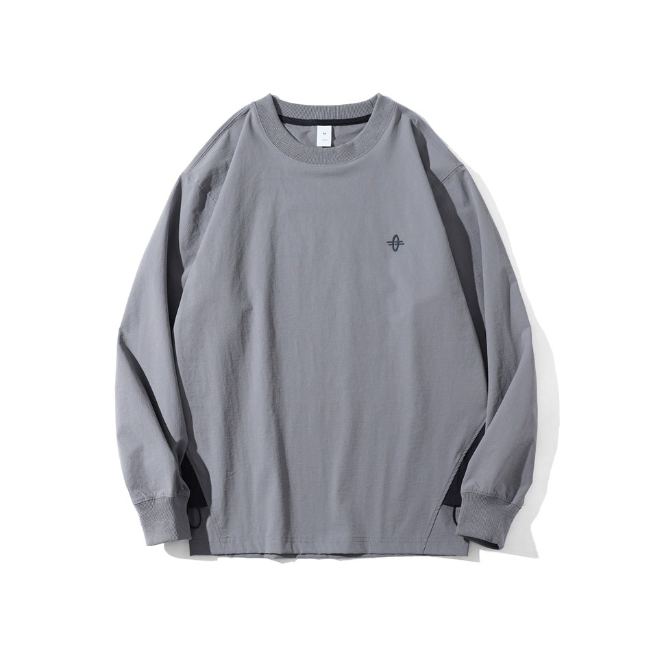 Gray long-sleeve crew-neck top with ribbed collar and cuffs, small chest embroidery and dark side hem panels
