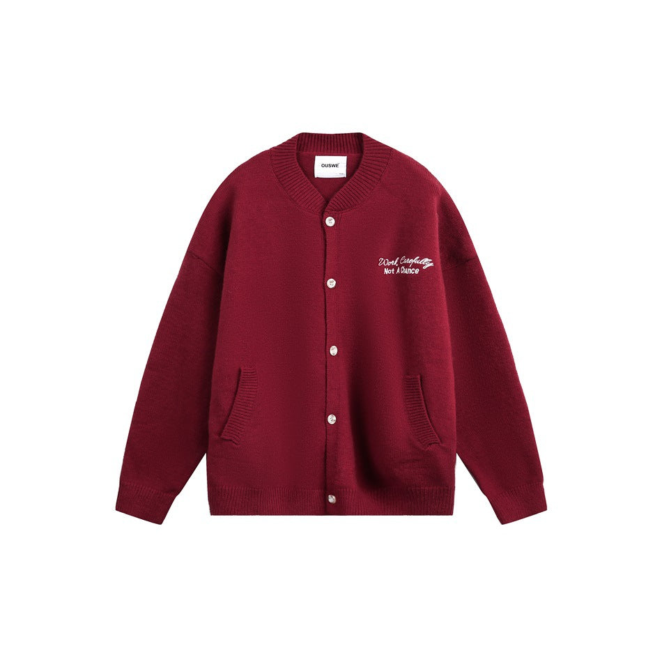 Burgundy knit button-front cardigan with ribbed collar, front pockets and white chest embroidery, flat front view