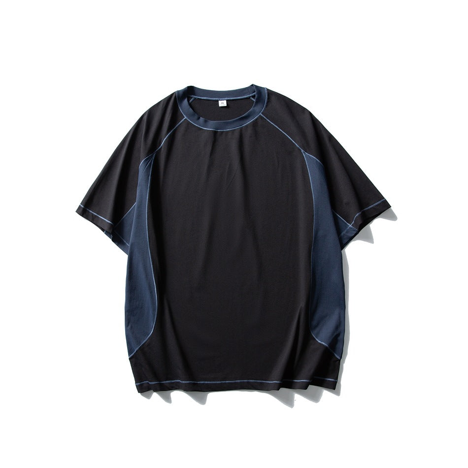 Black short-sleeve T-shirt flat lay with navy side panels and neckband and light blue contrast topstitching