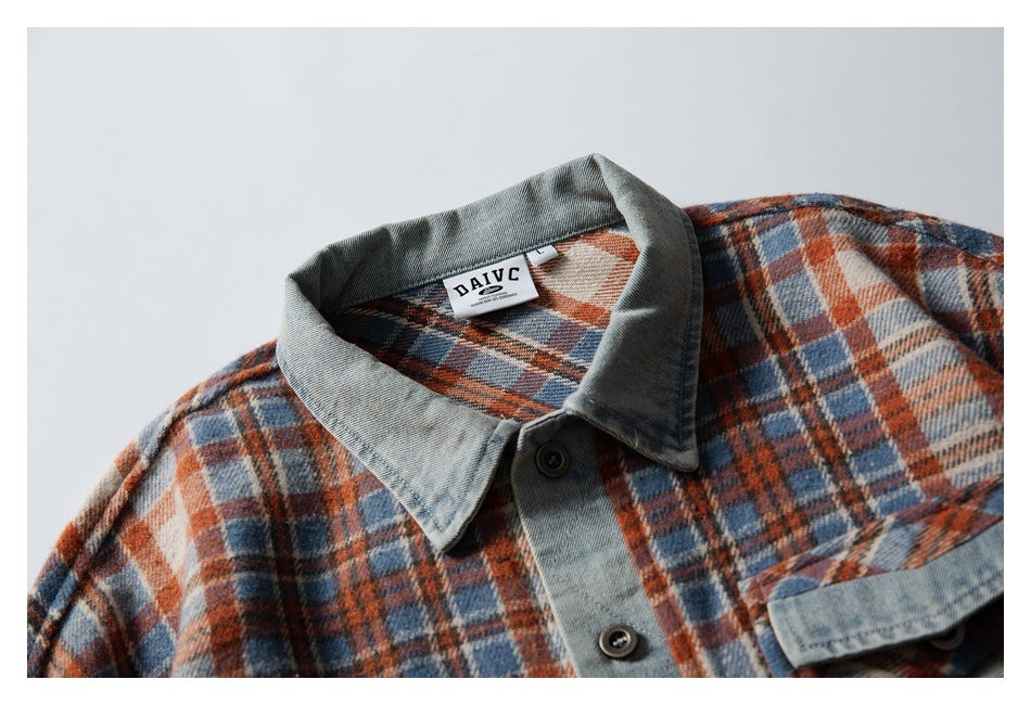 Close-up of a rust, blue, and cream plaid shirt with a gray denim-style collar, buttons, and a visible DAVIC neck label.