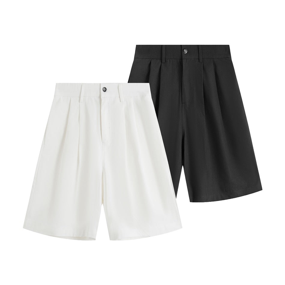 White and black wide-leg shorts shown from the front, with buttoned waistbands, belt loops and pleats.