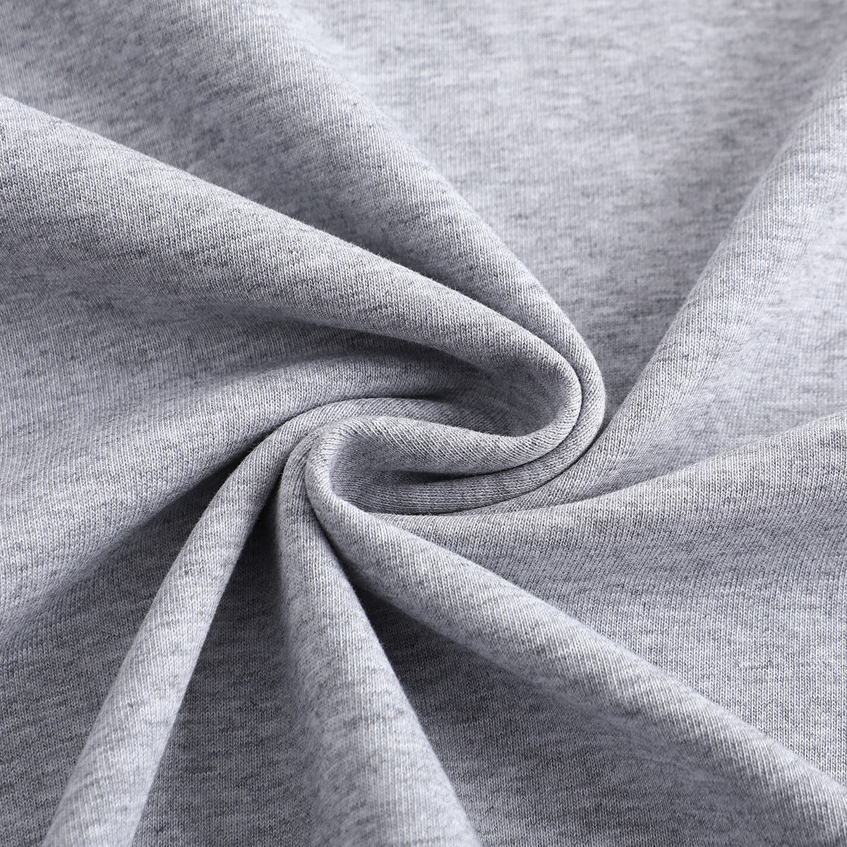 Close-up of heather-gray knit fabric draped into soft folds.