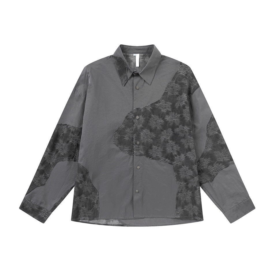 Dark gray long-sleeve button-front shirt with textured patchwork panels, flat front view