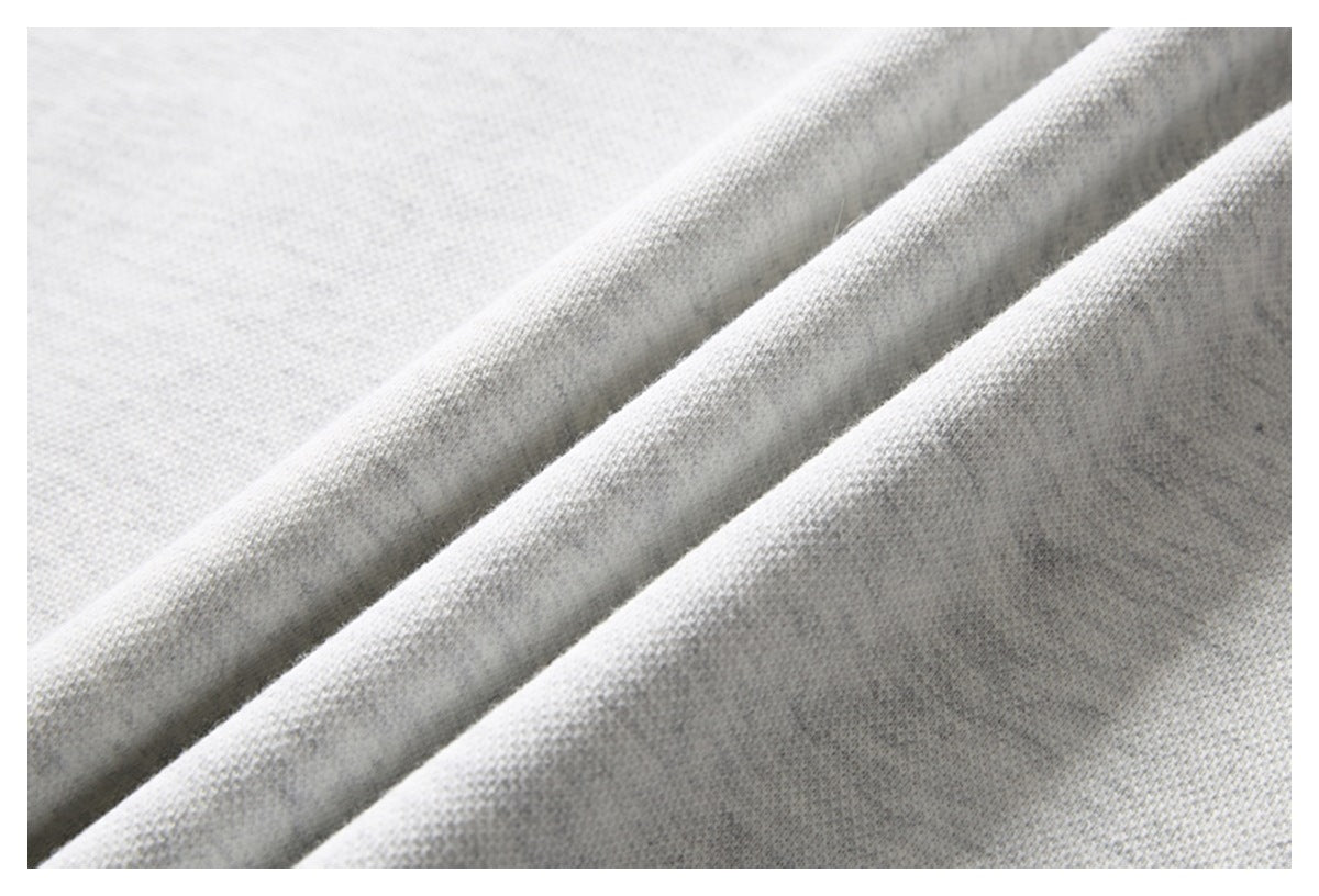 Close-up showing the light gray knit fabric draped in soft folds.