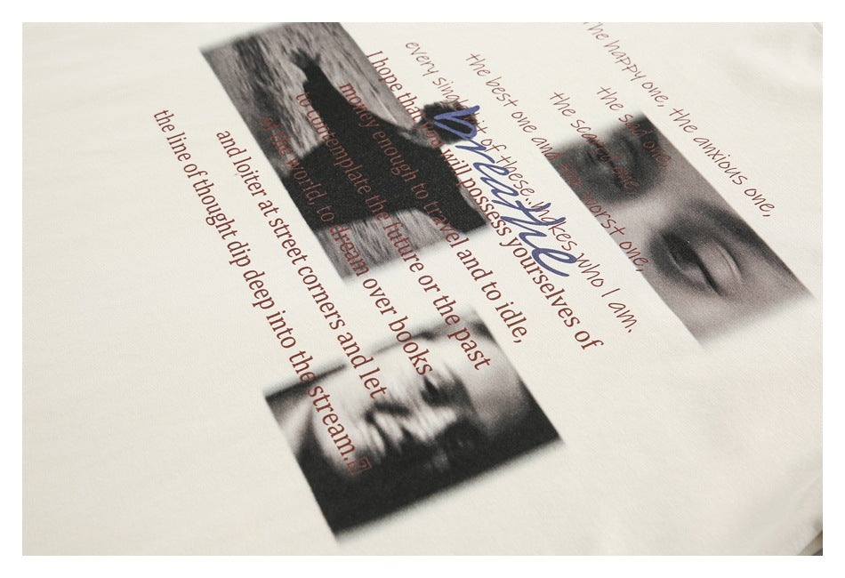 Close-up of a cream T-shirt print featuring grayscale portraits and lines of English text.