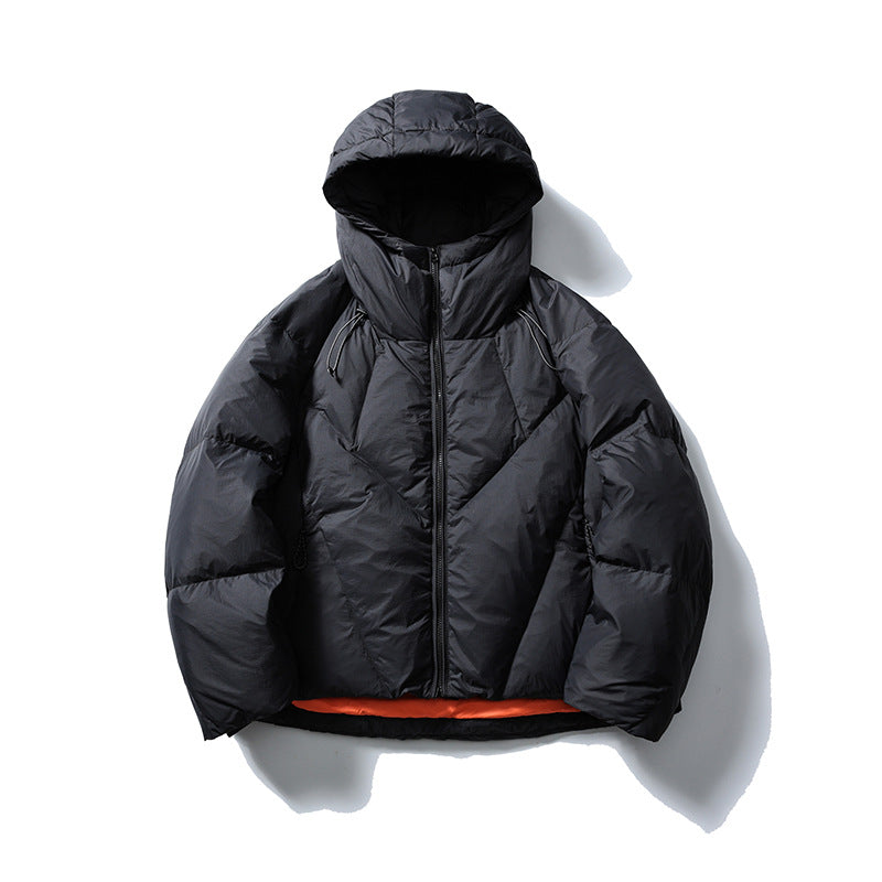 Black hooded puffer jacket with front zip and orange hem lining, flat view