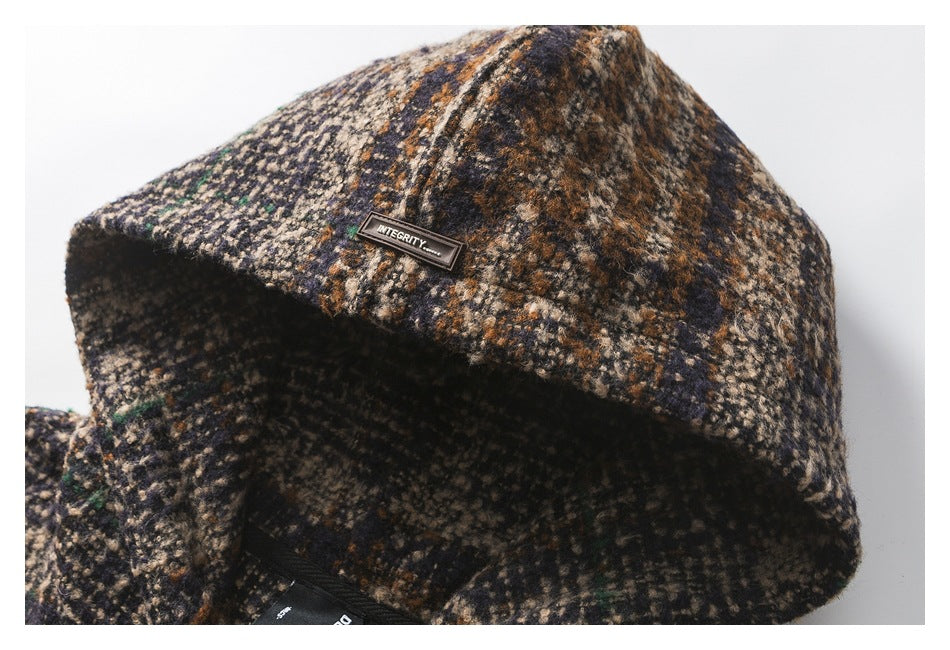 Close-up of the pullover’s plaid hood and a small sewn label.