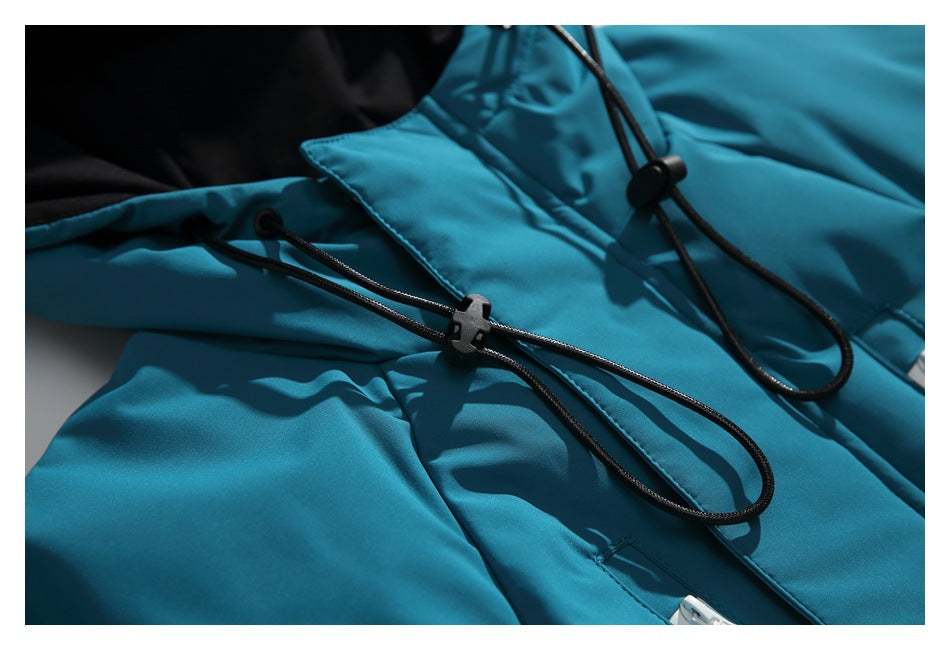Close-up of black hood-adjustment cords and toggles against the teal jacket.