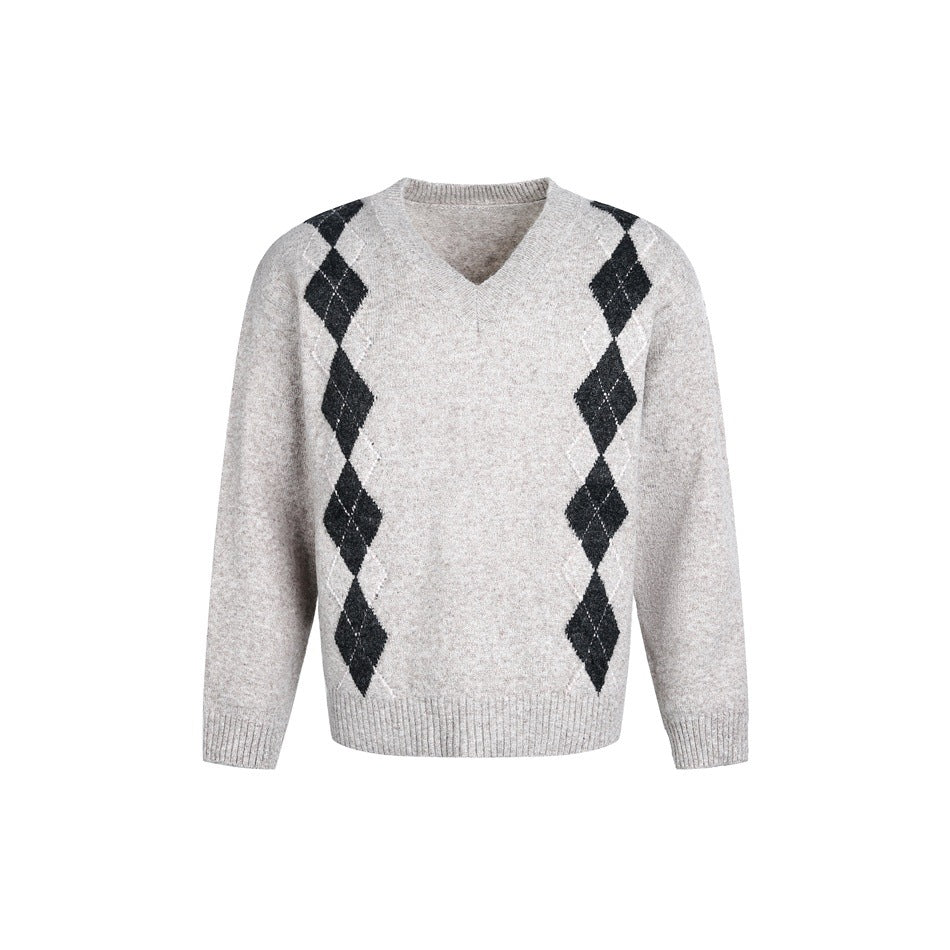 Light pink-apricot oatmeal V-neck argyle knit sweater with charcoal diamonds and ribbed hem, front view