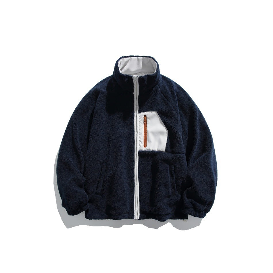 Front view of a navy fleece jacket with a white zipper and chest pocket panel, plus two hand pockets.
