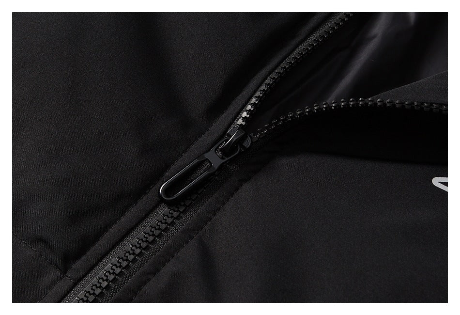 Close-up of the jacket's black zipper and pull.
