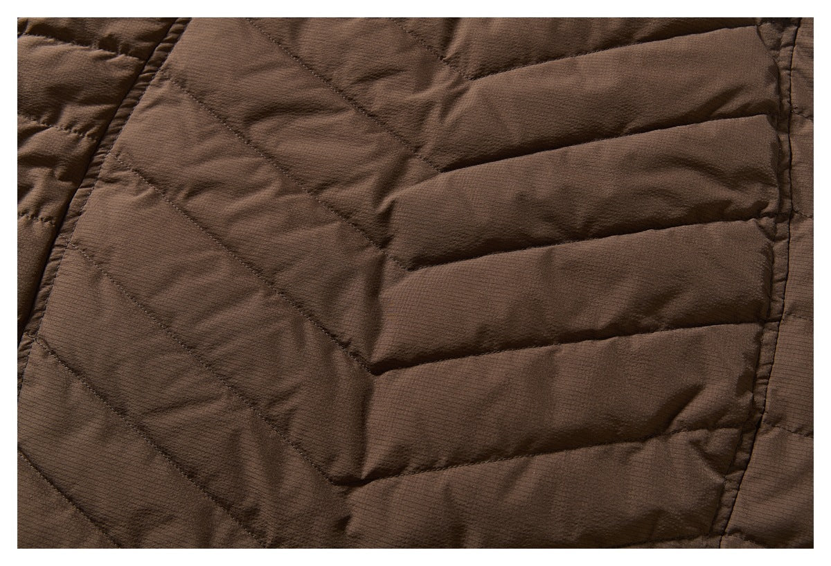 Close-up of the brown jacket's quilted panels and diagonal stitching.